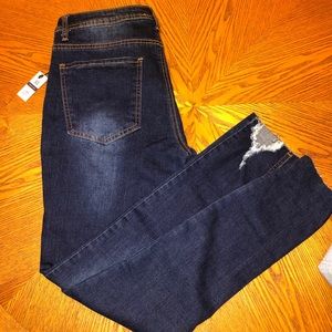 Distressed mid rise skinny jeans